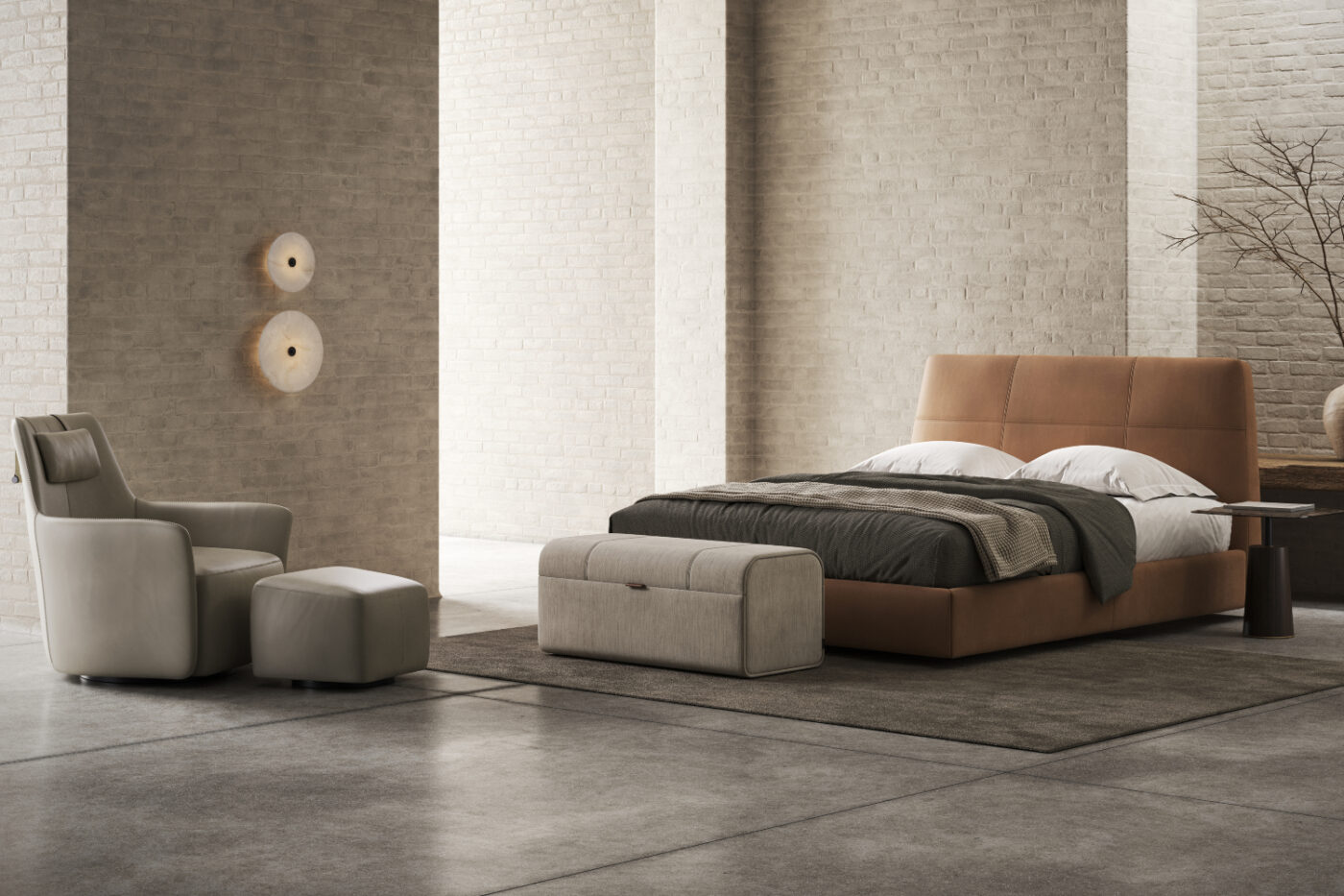 An inviting bedroom with a well-arranged bed, an armchair, and a functional ottoman enhancing the space's comfort. The armchair has cross stitching.