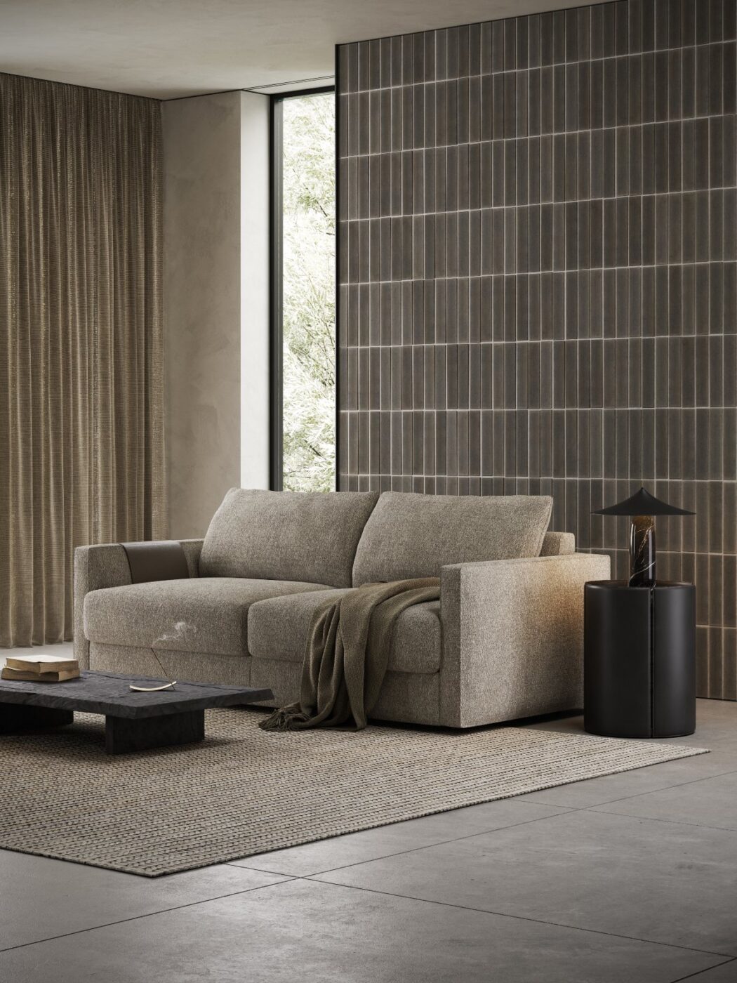 Living room with Beaumont Sofa Bed, a sofa that it turns easily into a bed. With a side table in leather, the Mano Side Table. The ambiance is in neutral and dark colours.