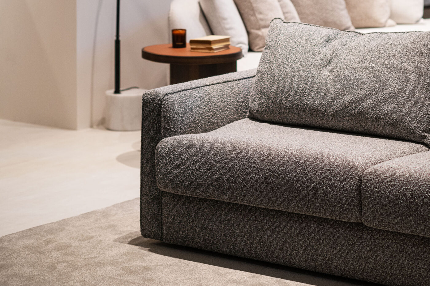 Beaumont sofa in a grey fabric and boucle fabric.