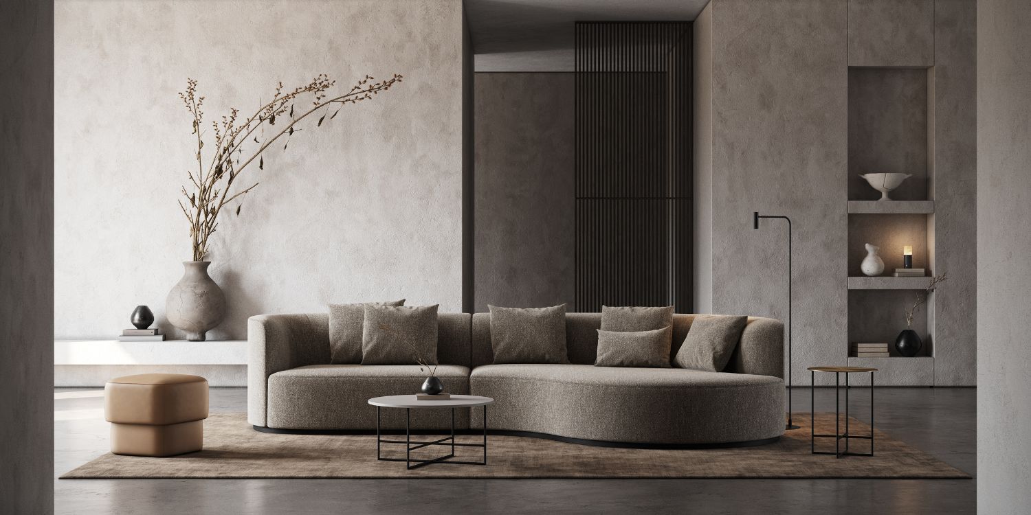 A Shibui living room featuring a stylish sofa and a sleek coffee table, creating a cosy and inviting atmosphere.