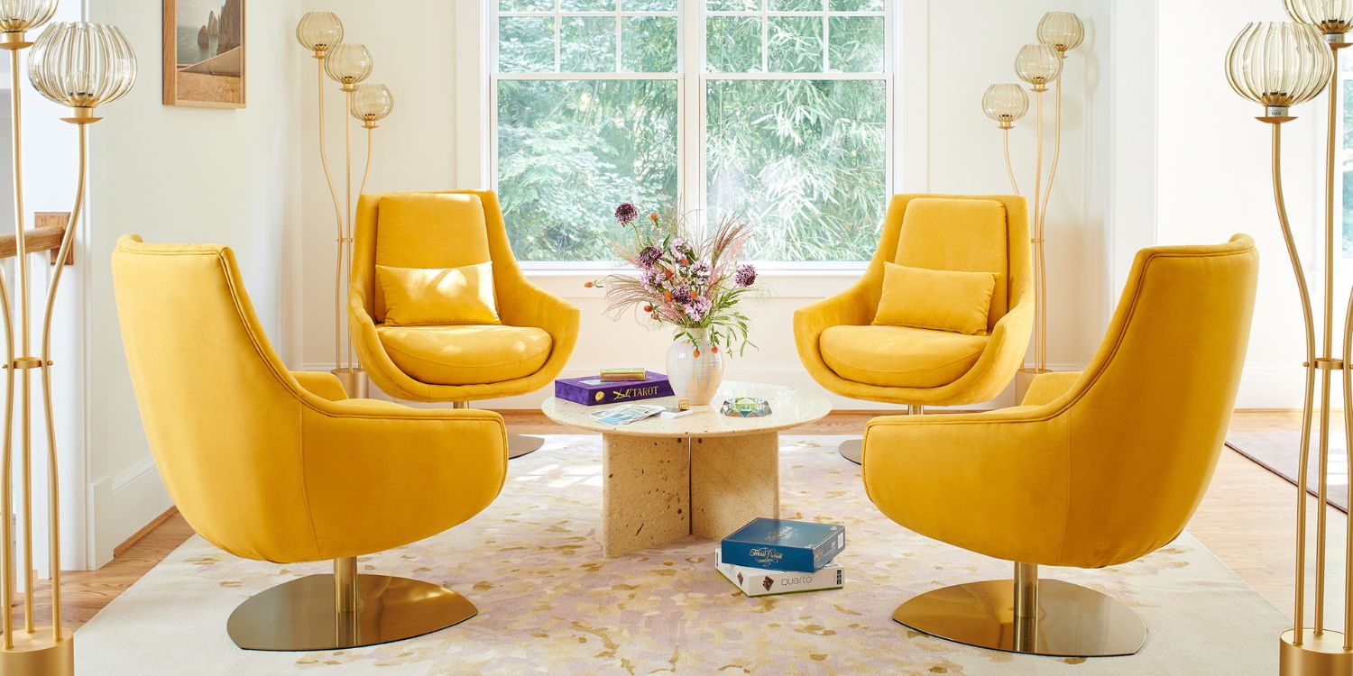 J. Fisher Interiors Project with four Elba Armchairs in yellow. The room is very light, with natural light, neutral colours and touches of gold.