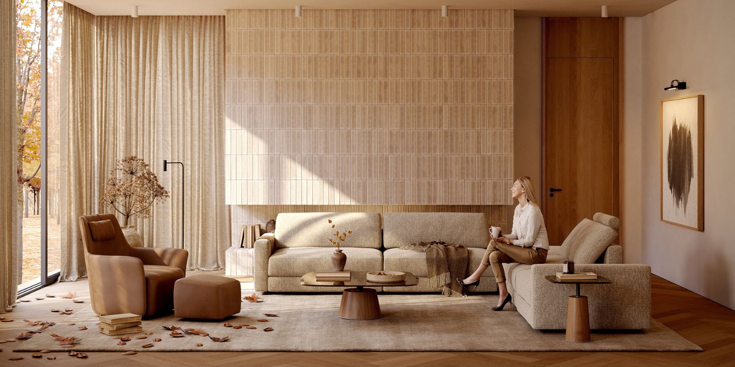 An autumn inspired living room in neutral tones and orange hues. With Edward Modular Sofa, Alexander Armchair, Panton Table Set. With leafs on the floor and seasonal plants.