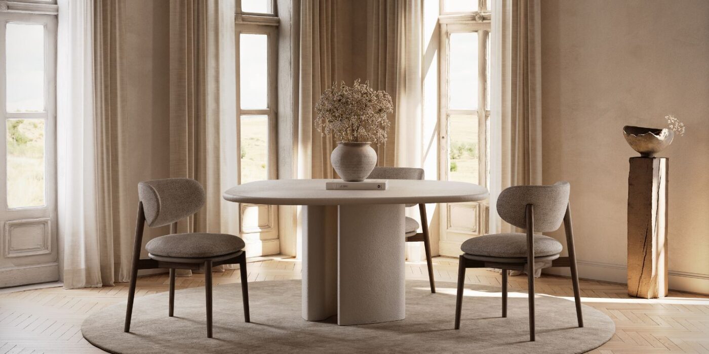 Blog Featured Image - 2026-05-06T112226.400 A round dining table accompanied by chairs in a bright room, designed for dining or collaborative activities.