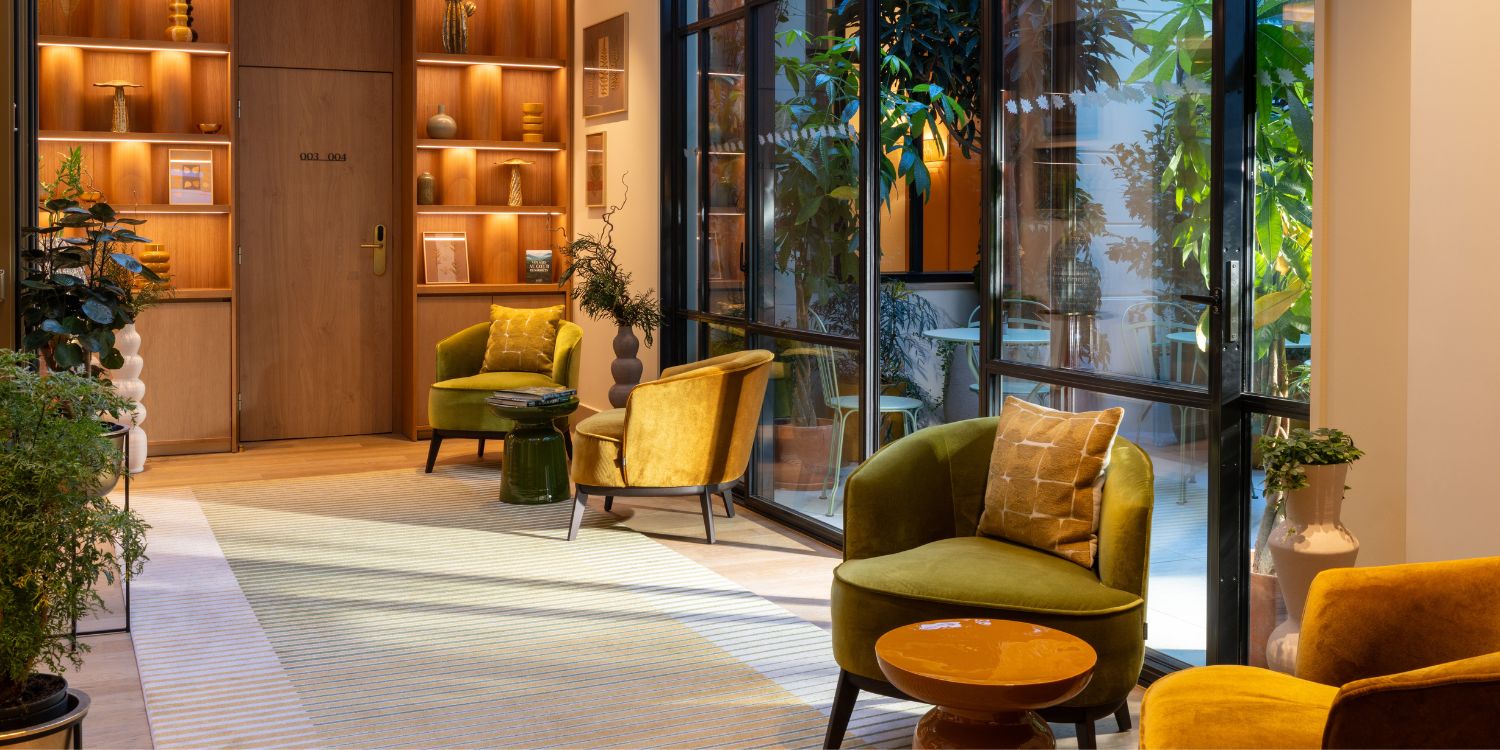 Megan Armchair At Le Cardinal Paris Hotel: Boutique Hospitality Through Comfort & Atmosphere