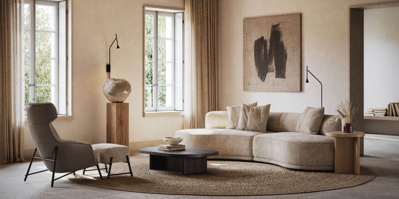 Blog Featured Image - 2026-09-10T143436.373 living room with a curved sofa in beige and an armchair with an ottoman.