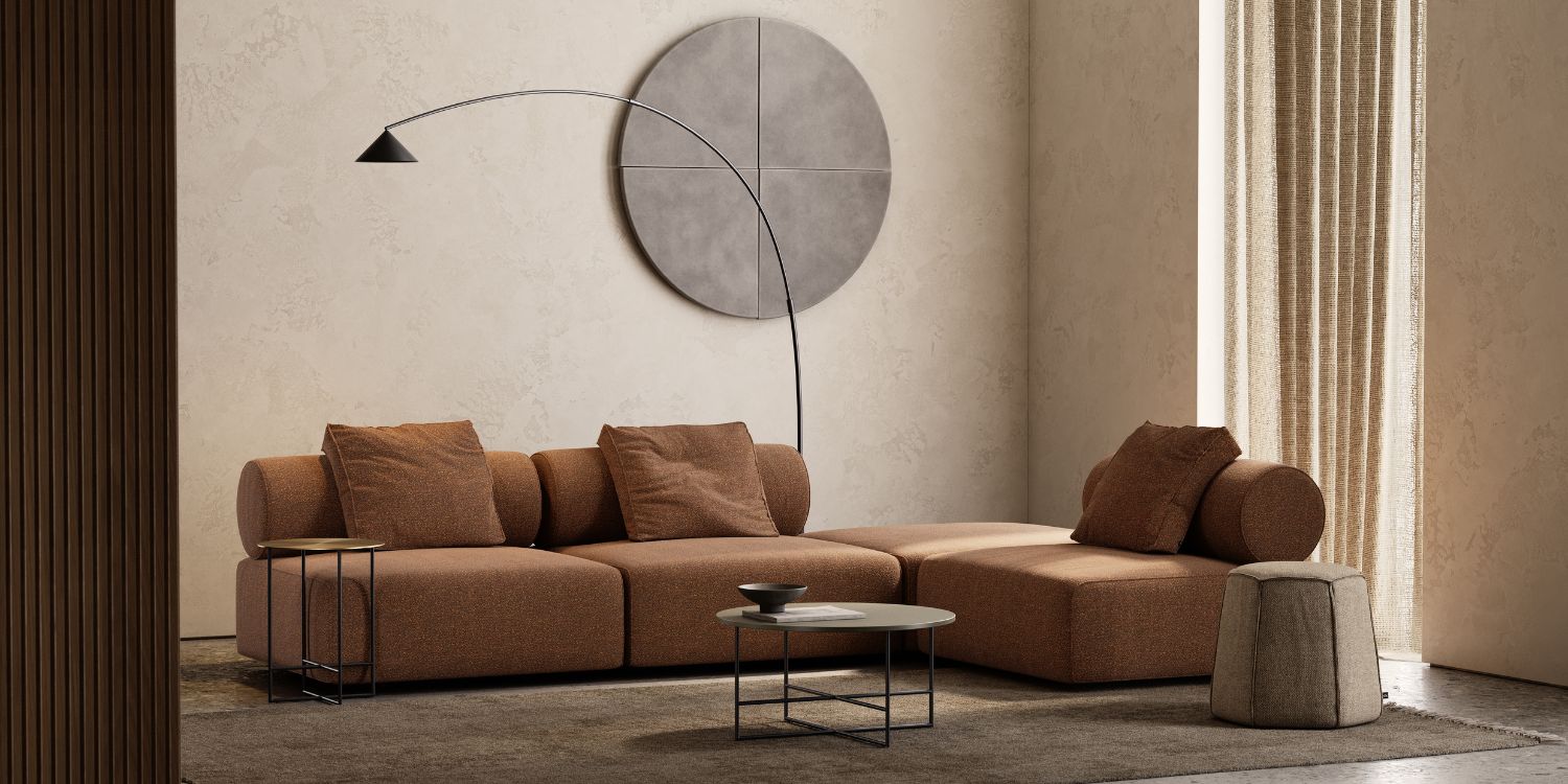 Contemporary living room with 70s colour trends showcasing a round table and a modular sofa, ideal for casual hangouts and lounging.