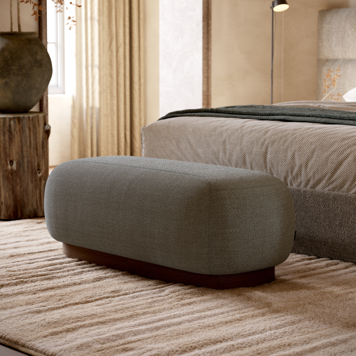 A stylish bed with a spacious Claire Bench positioned in the middle, enhancing the room's comfort and design.