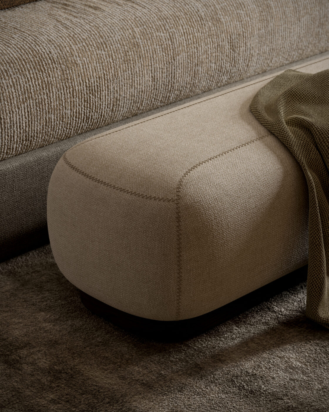 The comfortable Claire Bench featuring a warm blanket draped over it, perfect for lounging.