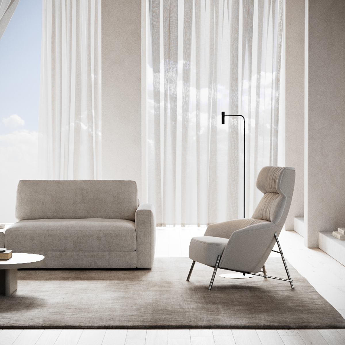 A cosy living room in Cloud Dancer featuring a modular sofa, coffee table and armchair arranged for relaxation and socialising.