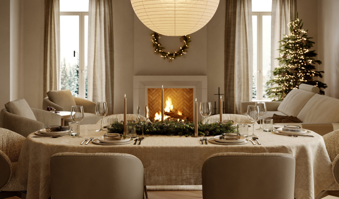 A festive dining room with a warm fireplace and a table elegantly arranged for Christmas dinner.