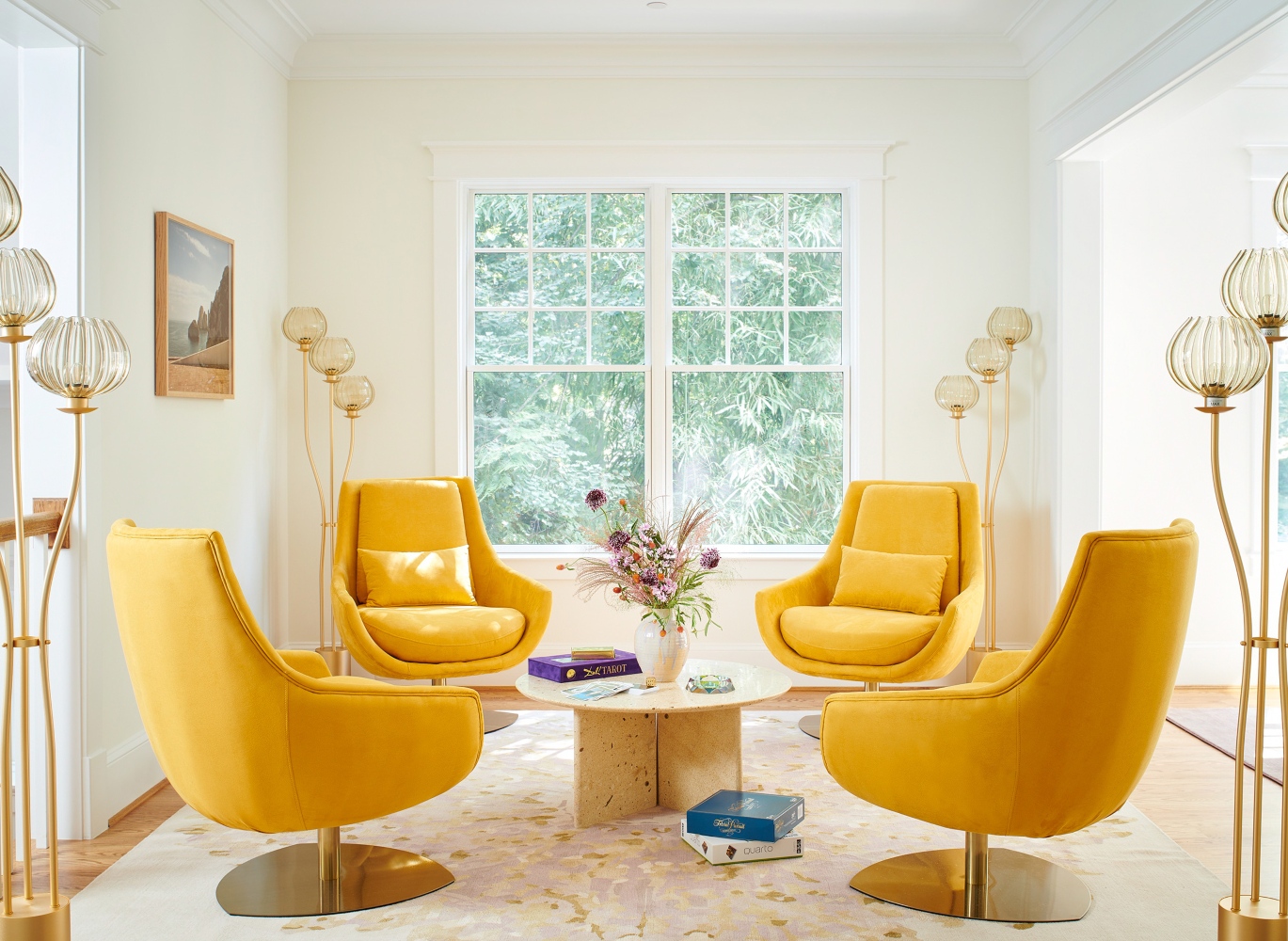 J. Fisher Interiors Project with four Elba Armchairs in yellow. The room is very light, with natural light, neutral colours and touches of gold.