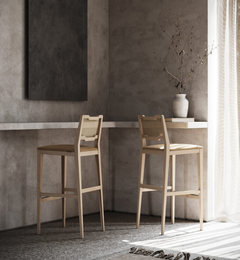 A room showcasing two wooden stools alongside a vibrant painting, enhancing the space's aesthetic appeal.