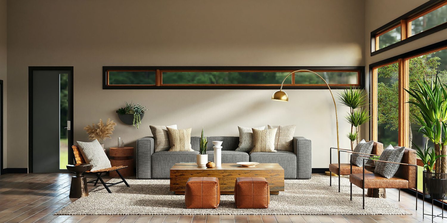 The Essential Principles of Feng Shui in a living room with a grey sofa in the centre, two armchairs on the right side and one on the left side. In front of the sofa is a coffee table in wood and two poufs in leather.