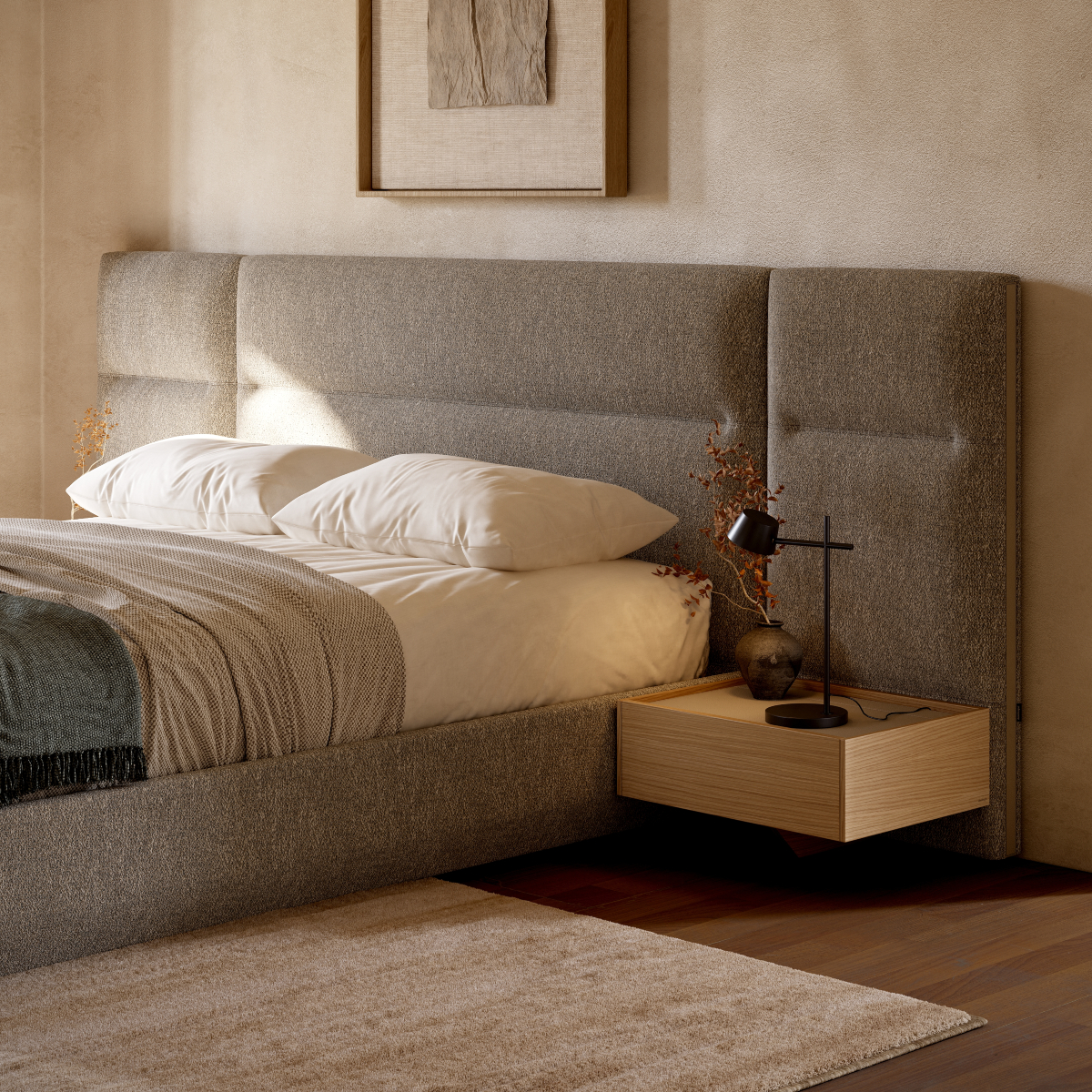 A comfortable modular bed with an elegant upholstered headboard and a integrated bedside table, enhancing the room's inviting feel.