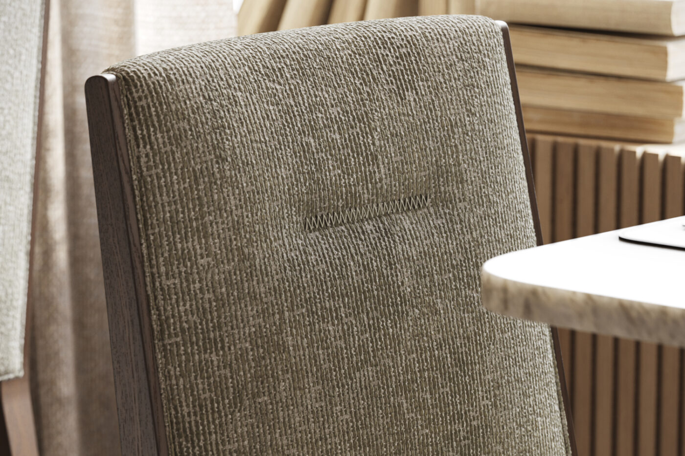 an upholstered chair with a Zig-Zag Stitching on the back.