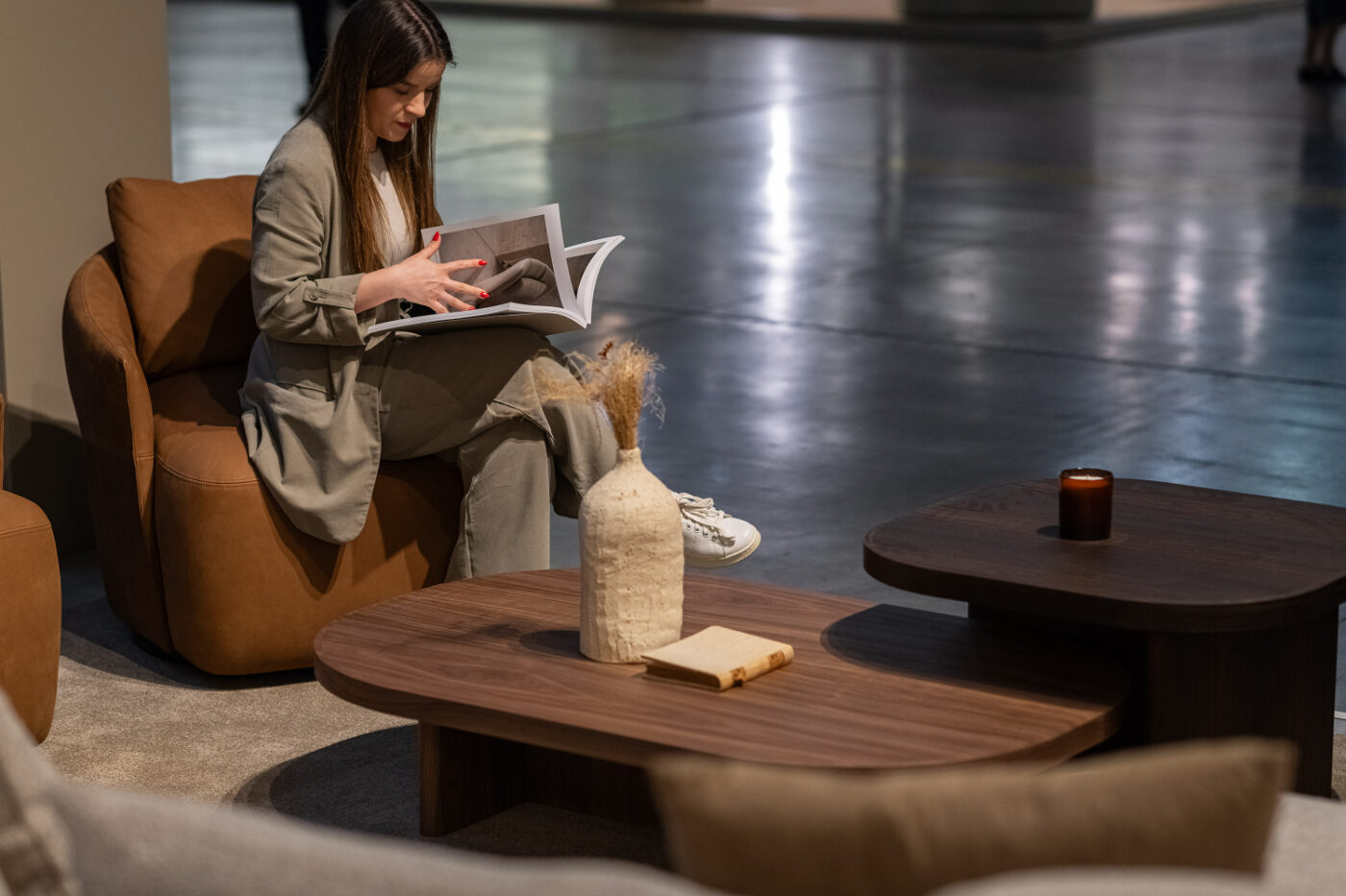 Modern interiors with gilbert table set in wood and alice armchair in an orange fabric