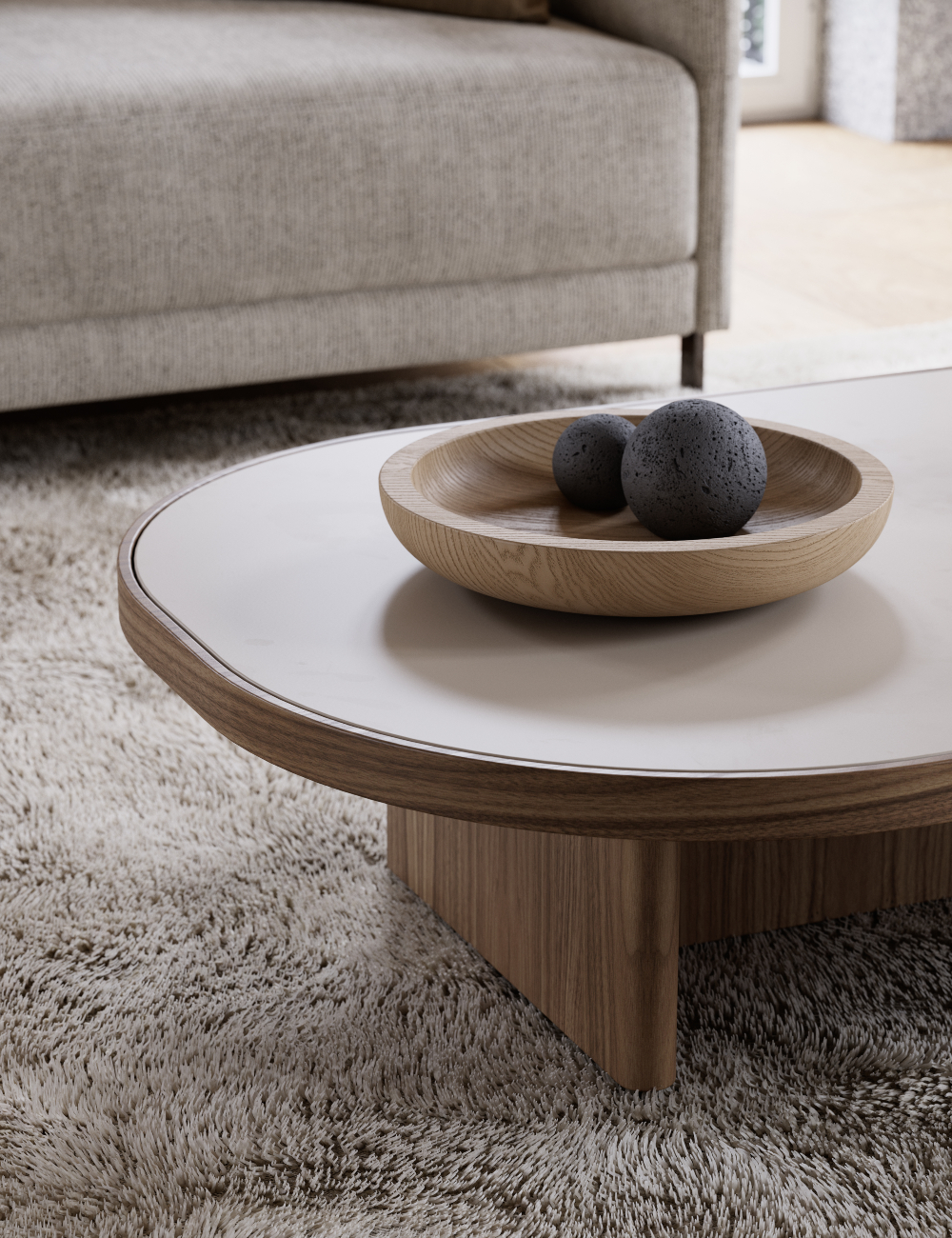 A white lacquered coffee table showcasing a bowl on its surface, emphasising a bright and uncluttered aesthetic. The lacquer is one of the trending materials of 2025.