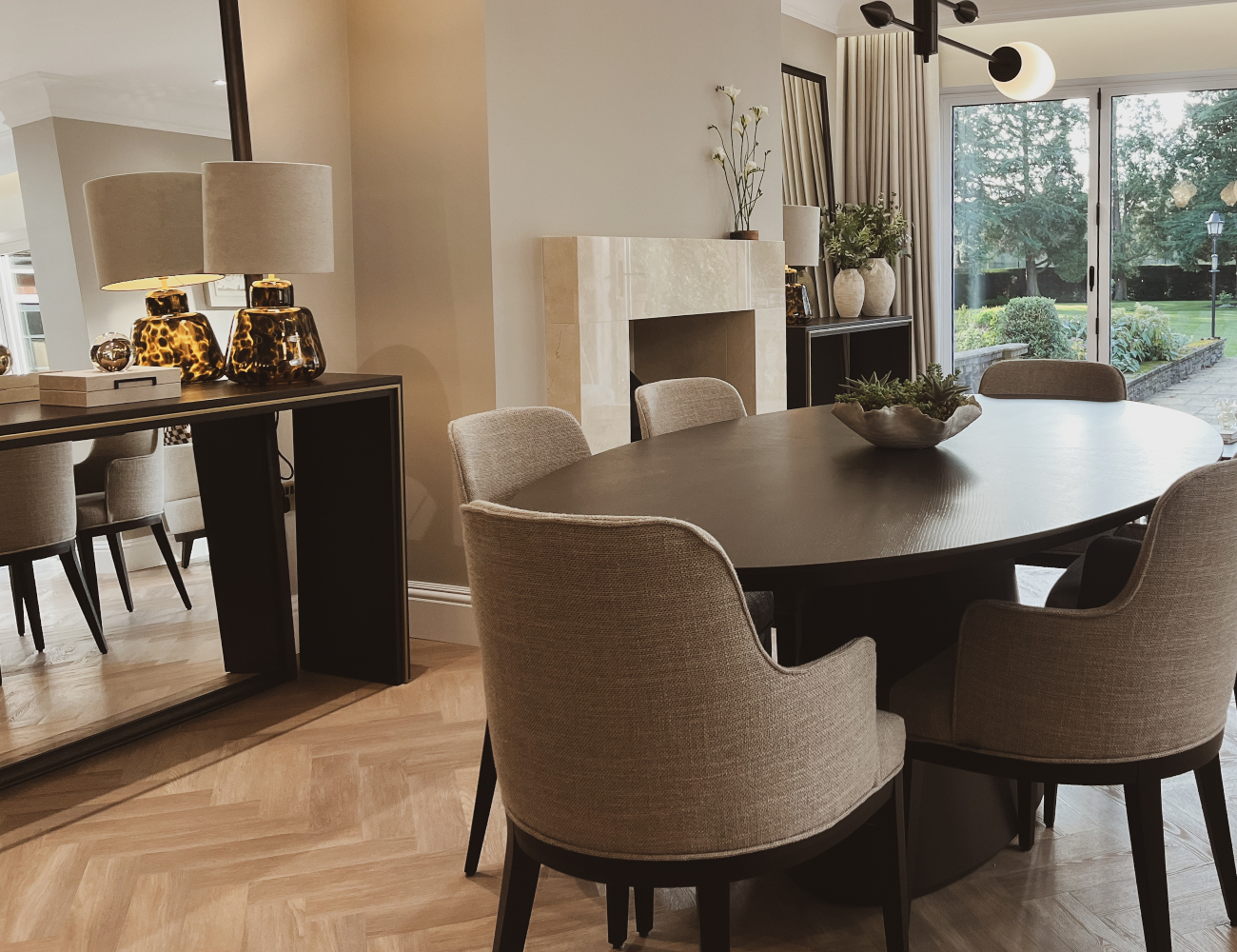 A bright dining room by Rossi Studio showcasing a stylish table and comfortable chairs, inviting for shared meals and conversations.