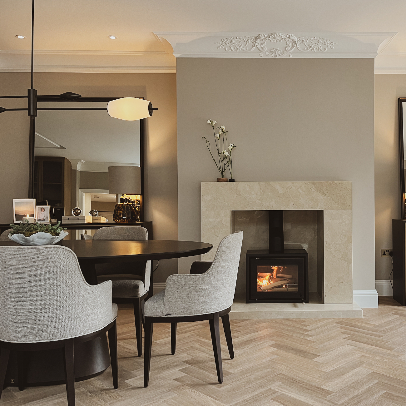 A bright dining room by Rossi Studio showcasing a stylish table and comfortable chairs, inviting for shared meals and conversations.