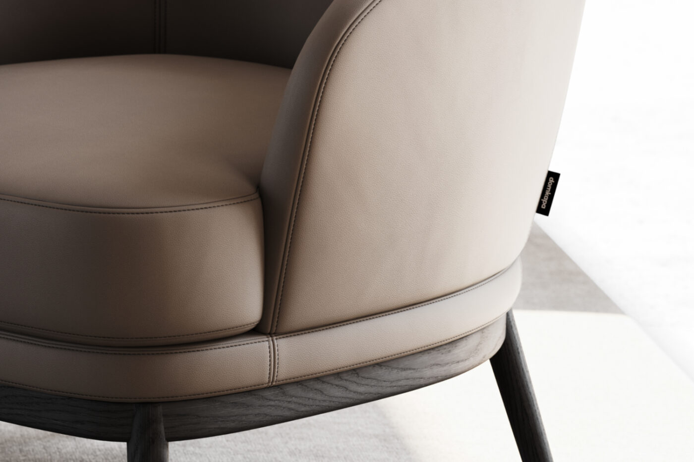 Close-up of a chair featuring a sleek leather seat, highlighting its texture and craftsmanship. The stitch presented is called top stitching.