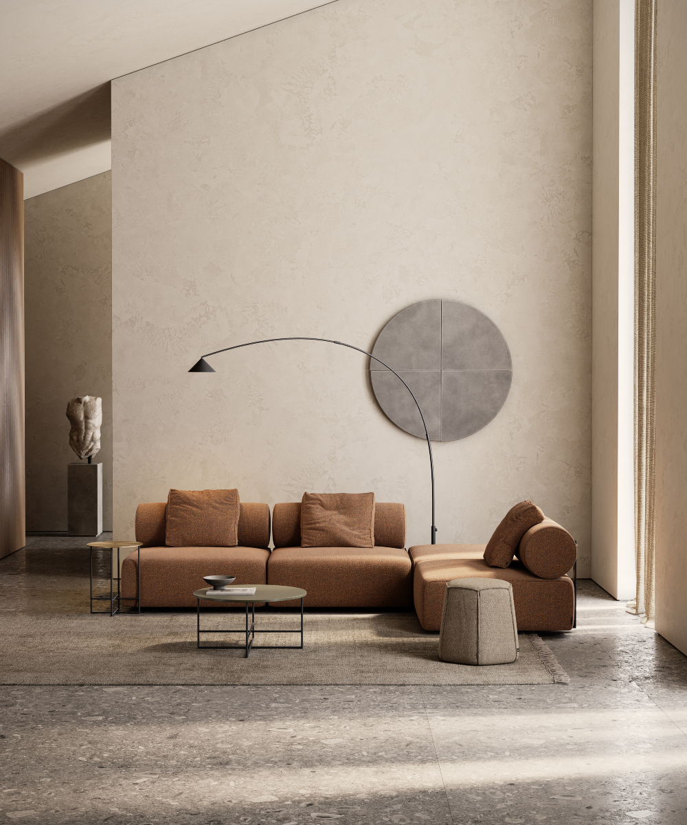 A contemporary living room showcasing a big round light, adding a warm glow to the sleek furniture and decor. The modular sofa perfect aligns with the 2025 interior design trends