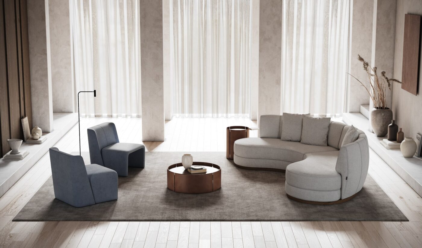 Cosy living room featuring a comfy curved sofa, a stylish armchair, and a small table for drinks or decor. Perfect aligned with the interior design trends for 2025.