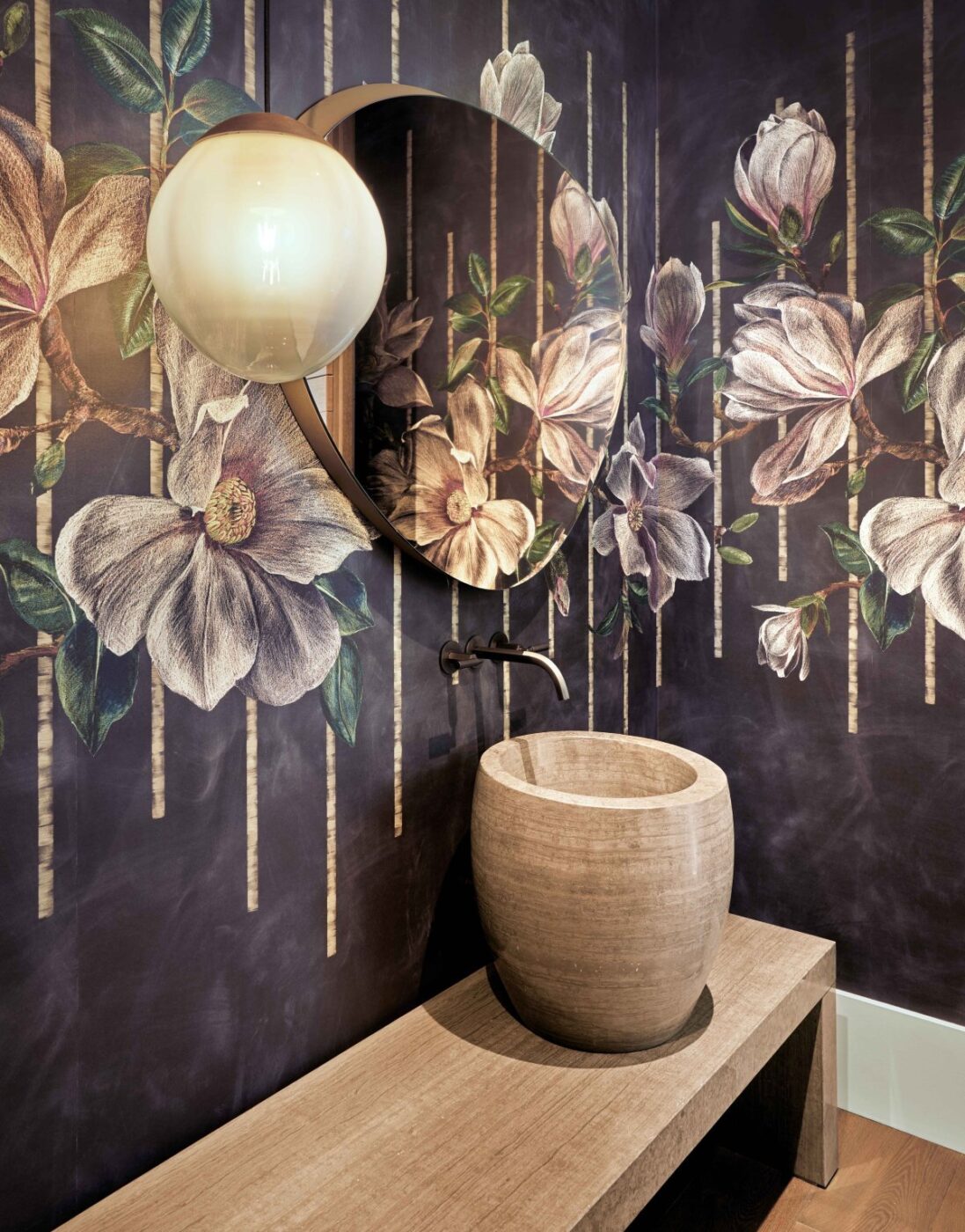 Trilogy Project by Shawback Design. Bathroom design with a dark wall with flowers and stone ornaments.