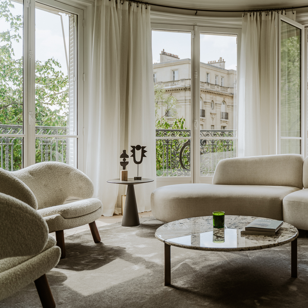 Living room project with neutral tones and views to the eiffel tower