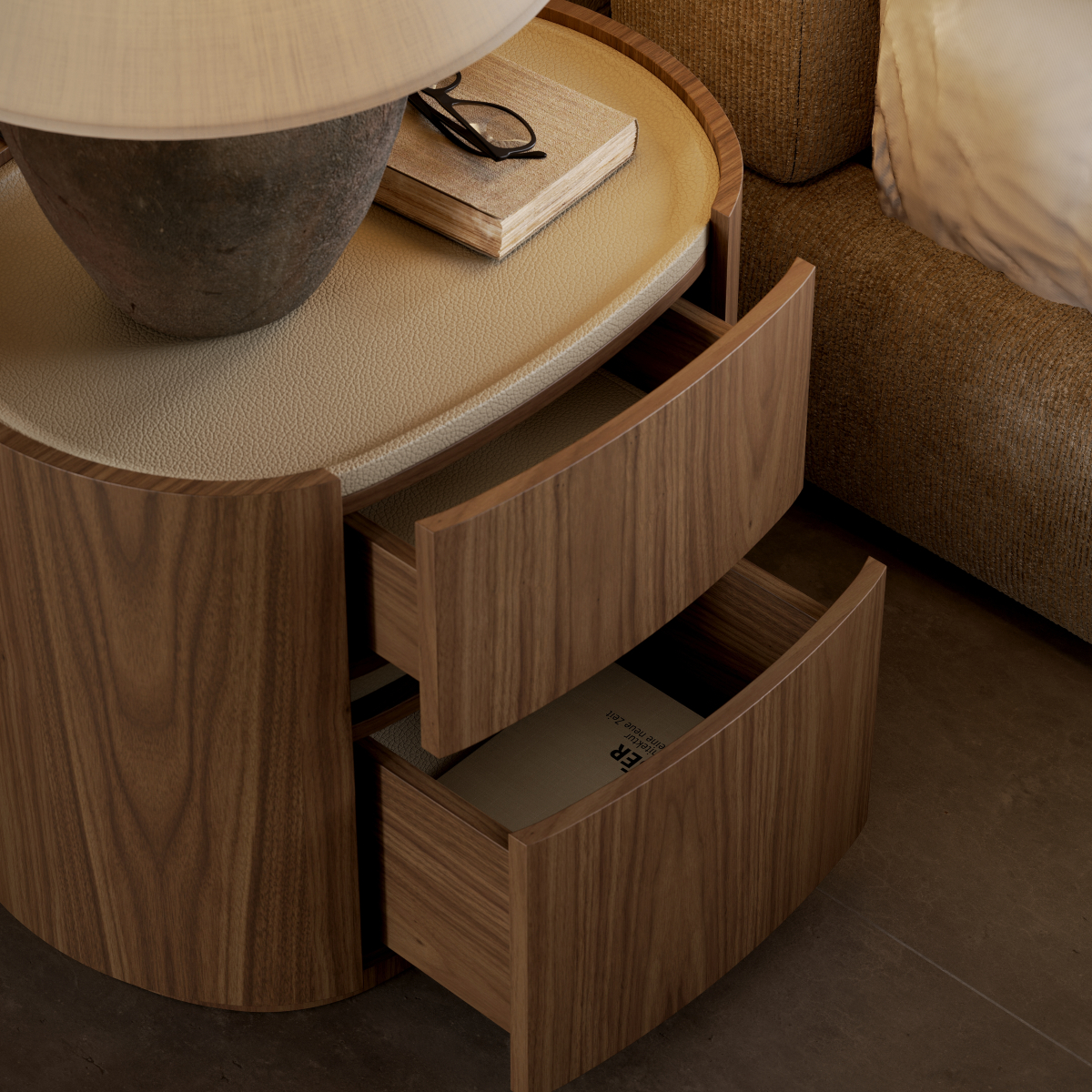 A bedside table with two drawers and a lamp, creating a cosy and functional nightstand setup in a bedroom design.