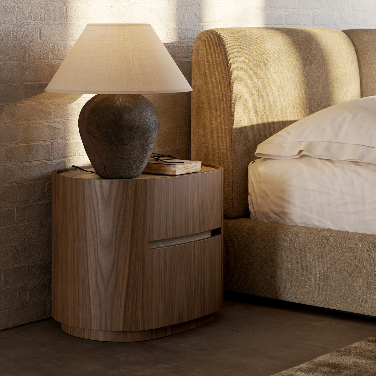 A comfortable bedside table topped with a lamp, creating a relaxing atmosphere.