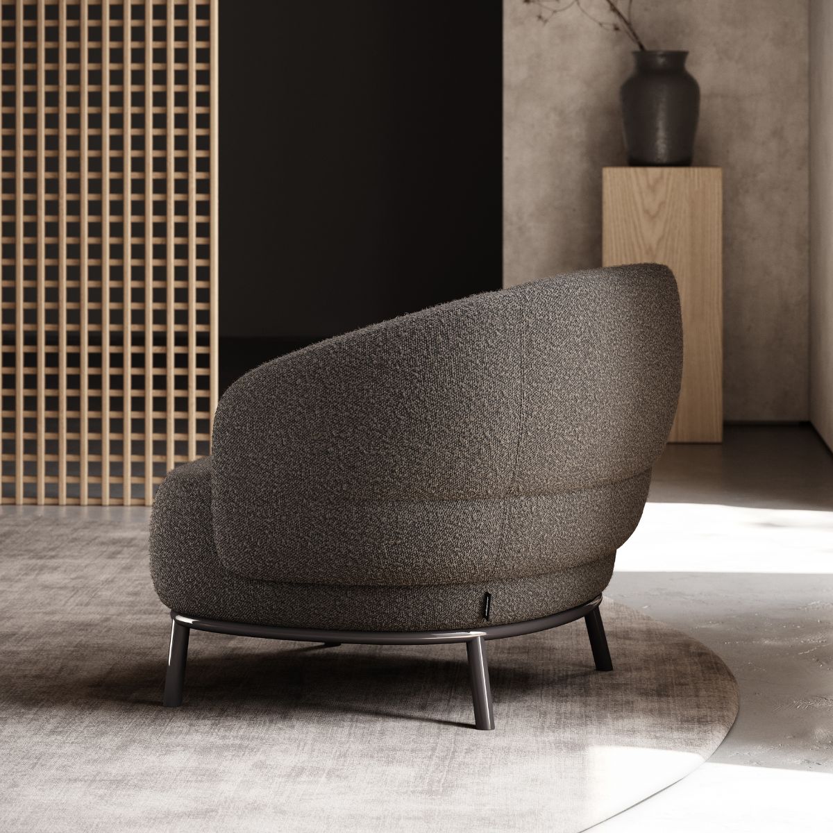 armchairs vs accent chairs by domkapa (4) A simple grey armchair located in a room with a natural wooden wall.