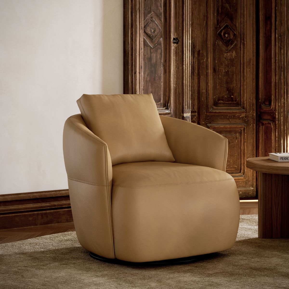 armchairs vs accent chairs by domkapa (5) A tan leather armchair set against a backdrop of wooden doors in a cosy room.