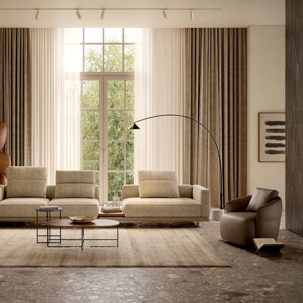 armchairs vs accent chairs by domkapa (6) A modern living room showcasing a sofa, am armchair and a lamp, designed for comfort and aesthetic appeal.