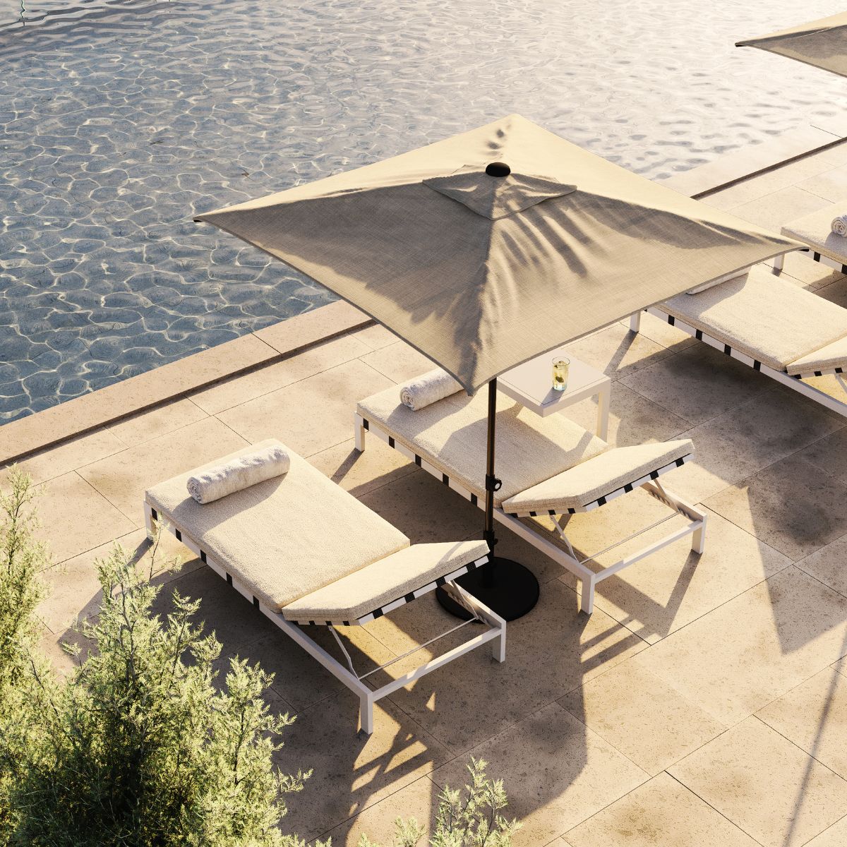 blog article about outdoor upholstery by domkapa (1) A serene pool scene featuring a lounge chair and a large umbrella for shade beside the water.
