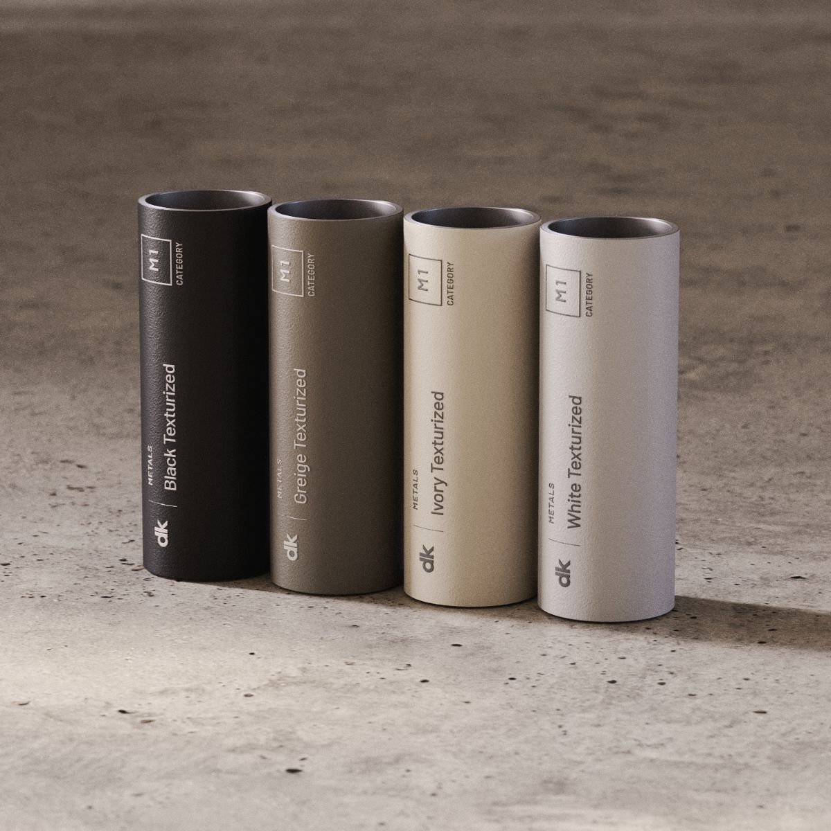 blog article about outdoor upholstery by domkapa (7) Three cylindrical metal swatches in varying colours: black, beige, white and green, positioned on a concrete floor.