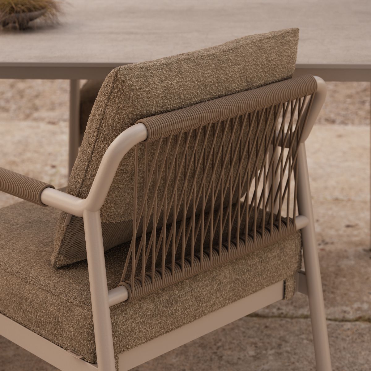 blog article about outdoor upholstery by domkapa (8) A modern outdoor chair with a sleek metal frame and a comfortable seat, ideal for an outdoor set.
