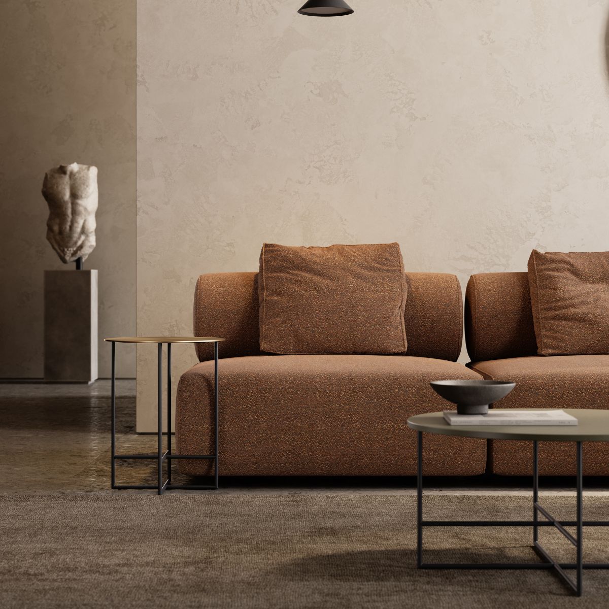 blog article about the end of summer refresh (1) A cosy terracotta sofa set against a wall, with art visible in the background. End-of-summer interior refresh