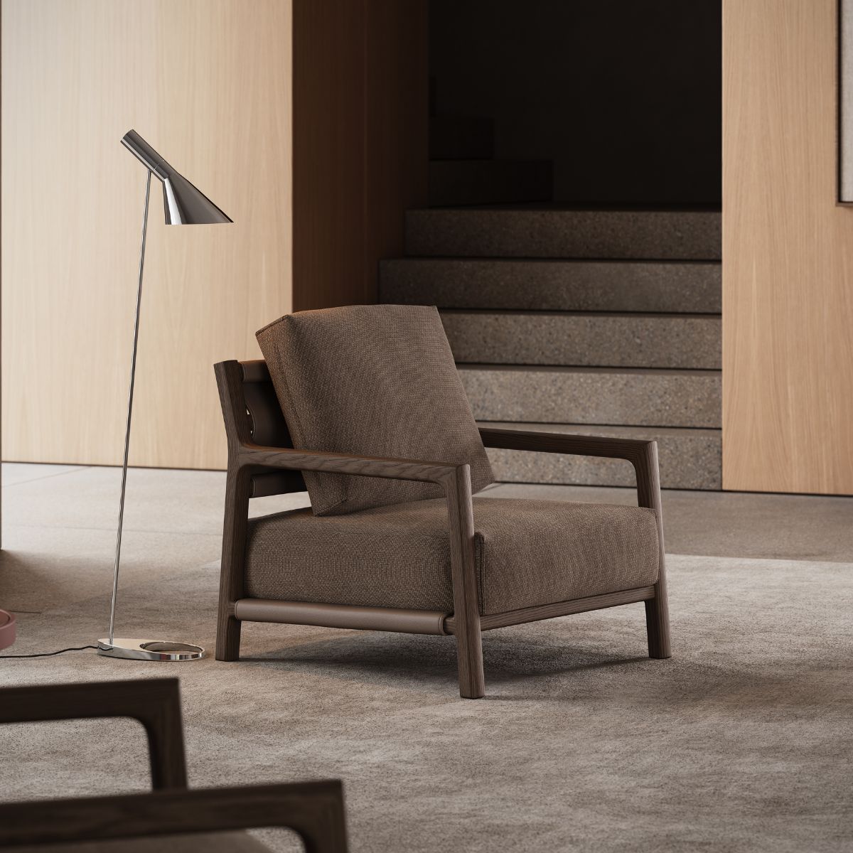 blog article about the hybrid living (1) A comfortable chair accompanied by a sleek lamp, set in a tastefully arranged room, ideal for relaxation or reading.