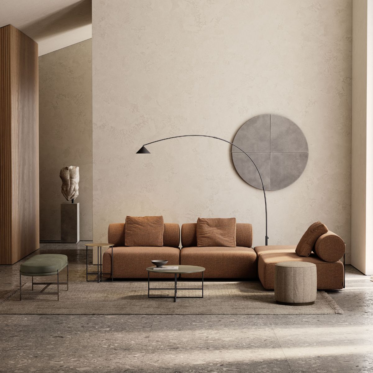 choose the perfect Domkapa sofa Modern living room with a rust-coloured modular sofa, minimalist black lamp, round tables, abstract wall art, and statue, creating a serene atmosphere. How to choose the perfect sofa