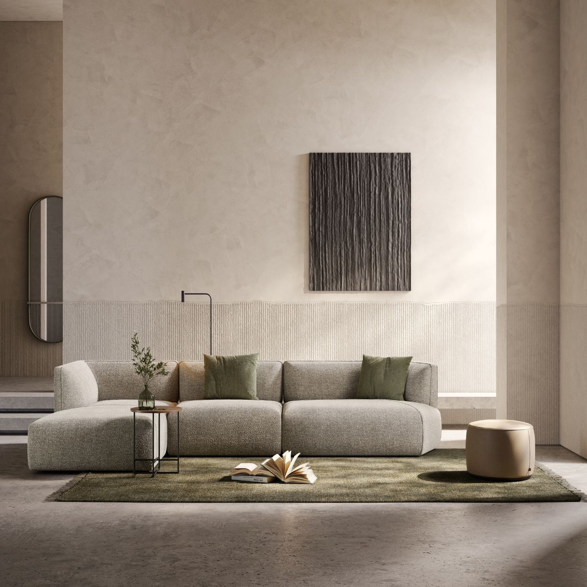 choose the perfect Domkapa sofa (1) Minimalist living room with a beige modular sofa, green cushions, and a small side table with a plant. An open book and a pouf are on a green rug. How to select the perfect sofa