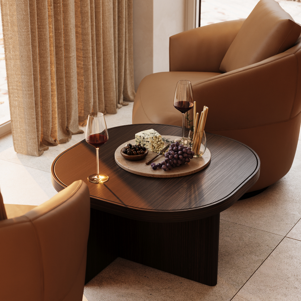 A coffee table displaying an array of wine and cheese, inviting for a social gathering or tasting event.