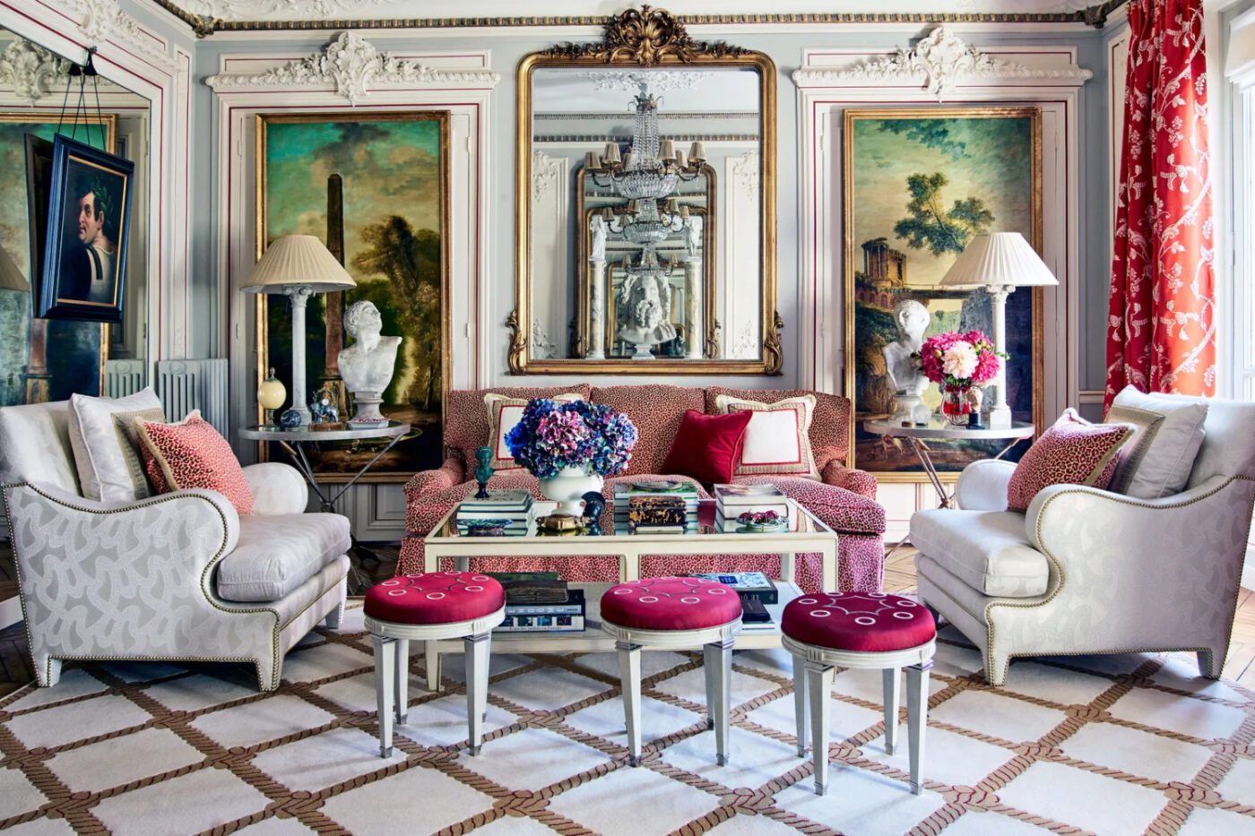 corrigan-paris-apartment-01-architectural-digest A richly decorated living room showcasing ornate furnishings and beautiful artwork on the walls. Classic style.