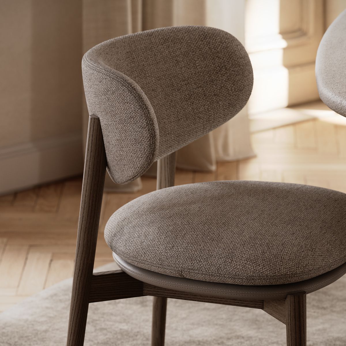 curves or clean lines by domkapa (5) A wooden chair with a circular seat and a supportive backrest, suitable for various settings. Curves or clean lines