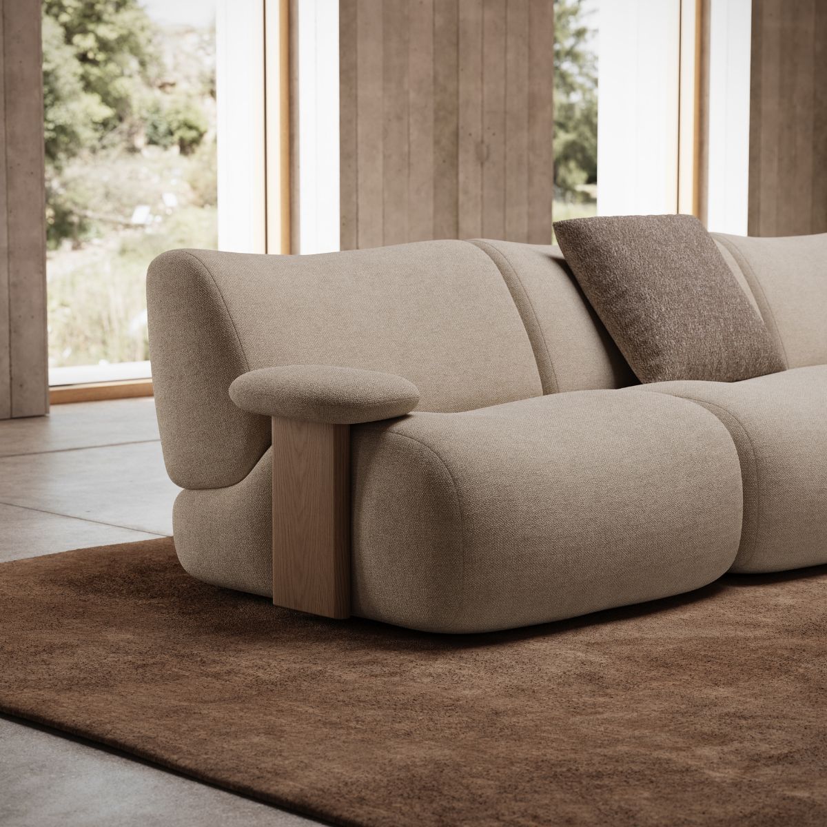 curves or clean lines by domkapa A modern sofa positioned in a bright room with large windows, allowing natural light to fill the space. Curves or clean lines