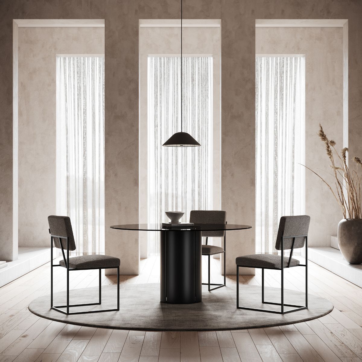danish interior design (8) Minimalist dining space with a round black table, three gray chairs, and a central pendant lamp. Tall windows cast soft light, creating an elegant, serene atmosphere.