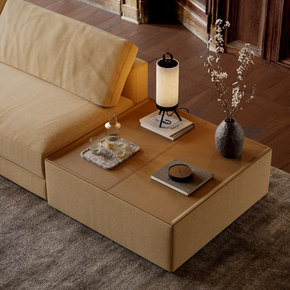 A modern sofa featuring a coffee table and a lamp, designed to complement the living area’s decor.