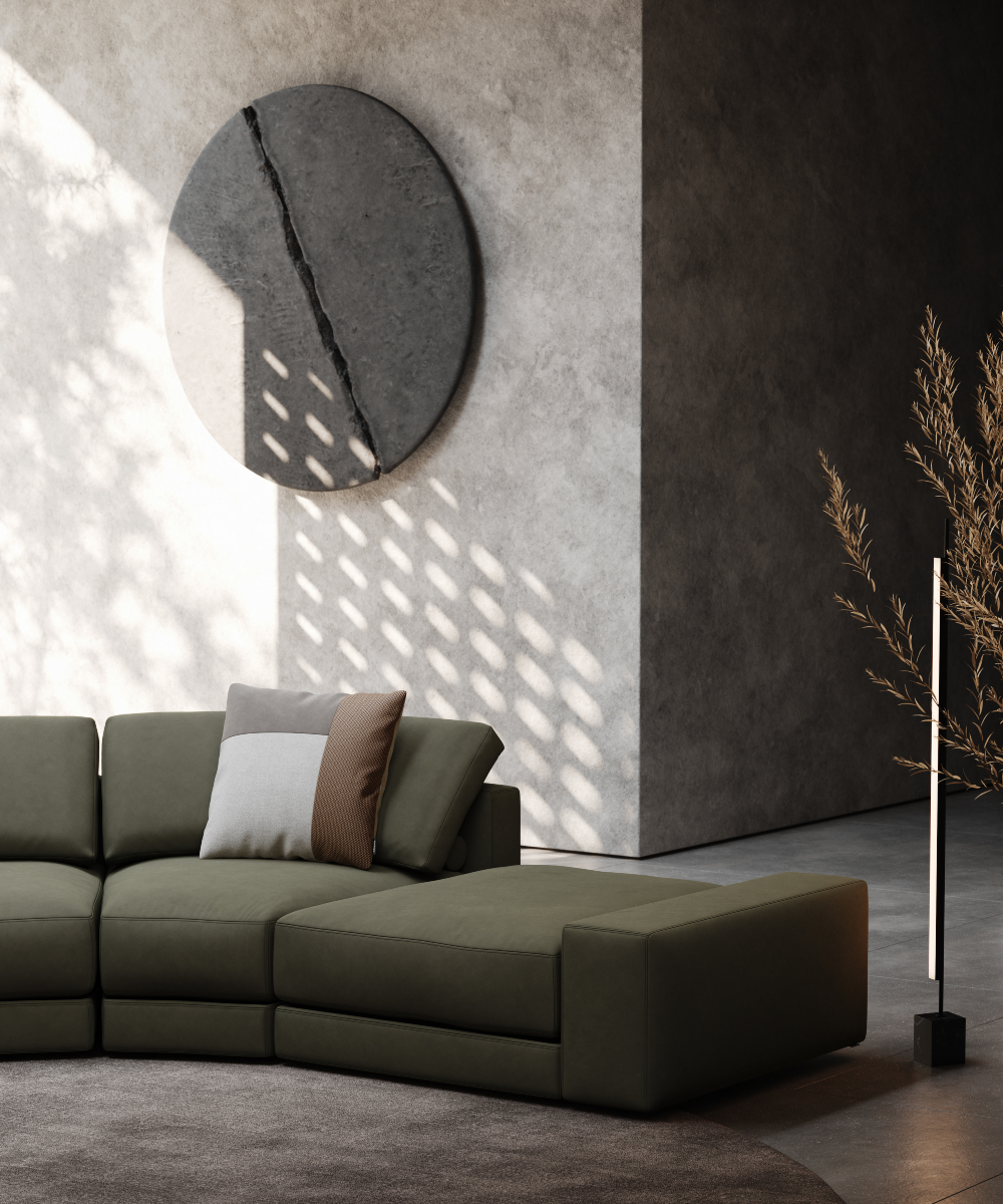 A modern living room featuring a large round wall art with a diagonal line on the wall, with stylish furniture and decor.