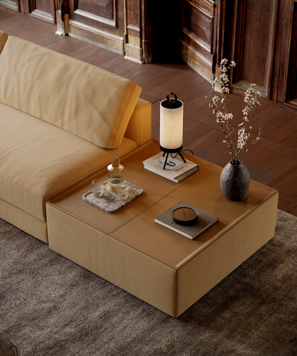 A comfortable modular sofa, perfect for brown interiors, featuring a side table and a lamp, adding charm to the room's decor.