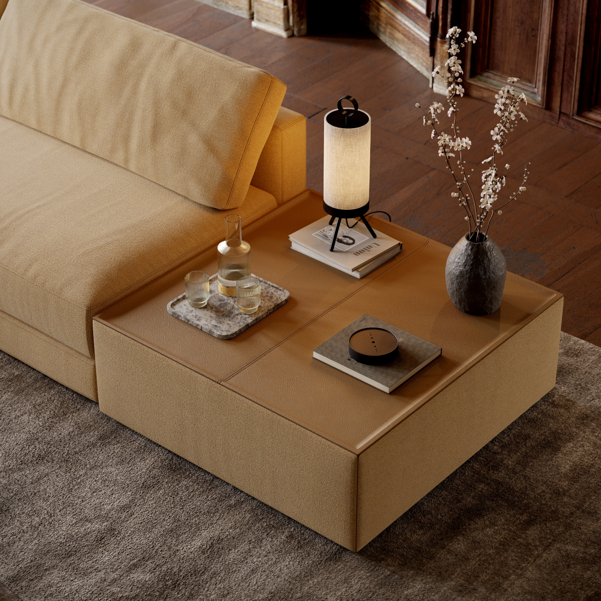 A modern modular sofa with a side table and lamp on it, enhancing the room's comfort and ambiance.