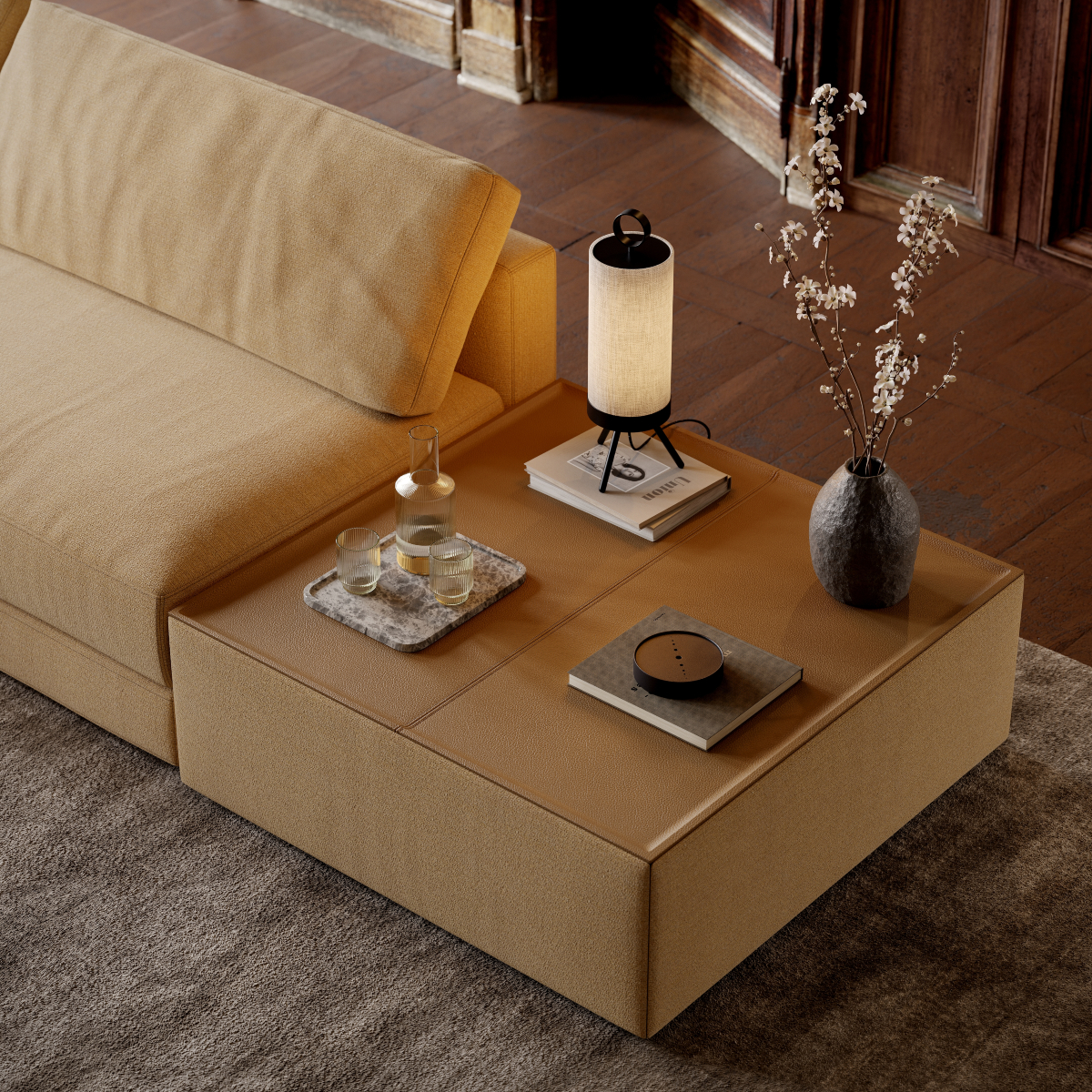 A modern sofa featuring a table and a lamp on it, adding elegance to the living area. Café core.